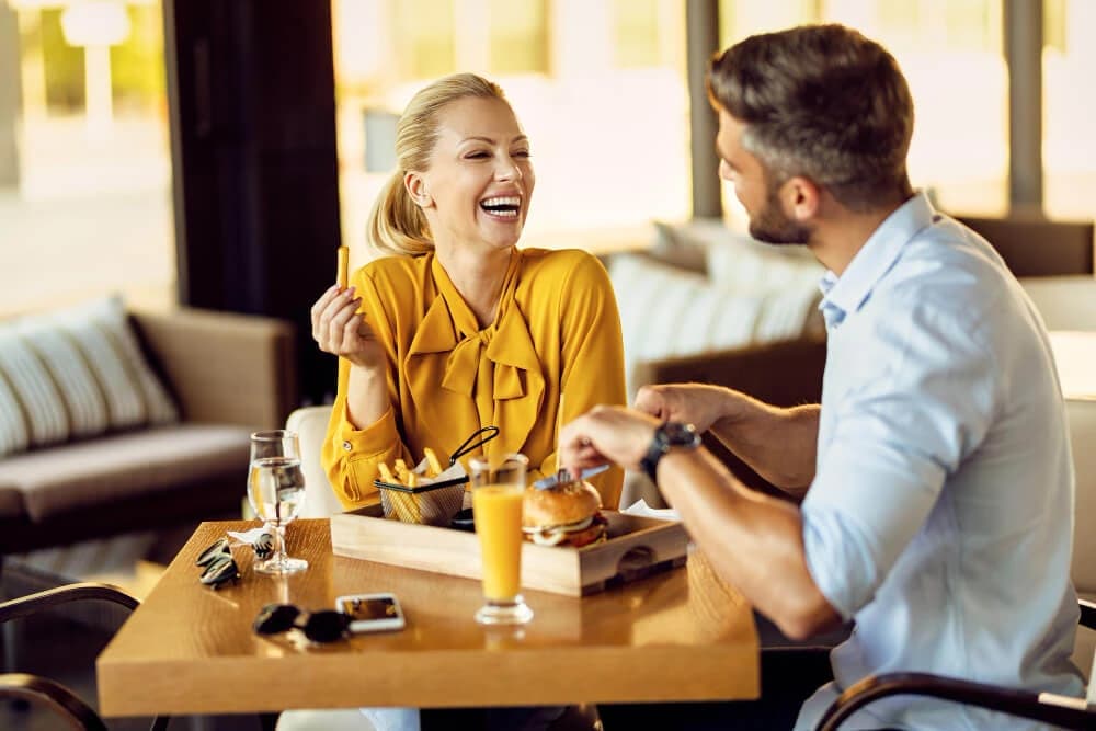 Two guests toasting with wine